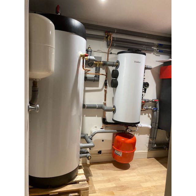 Plant room with hot water cylinder and heat pump kit